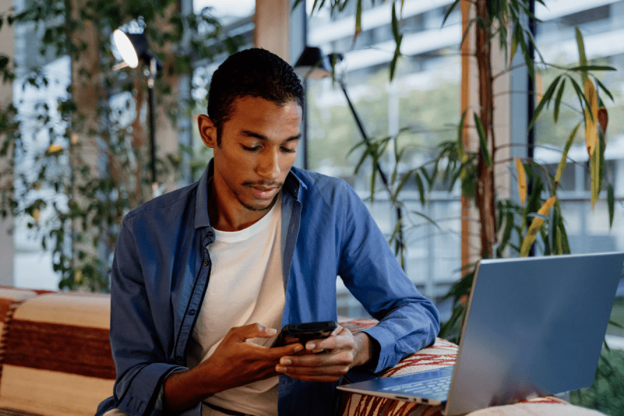 a young adult using his phone