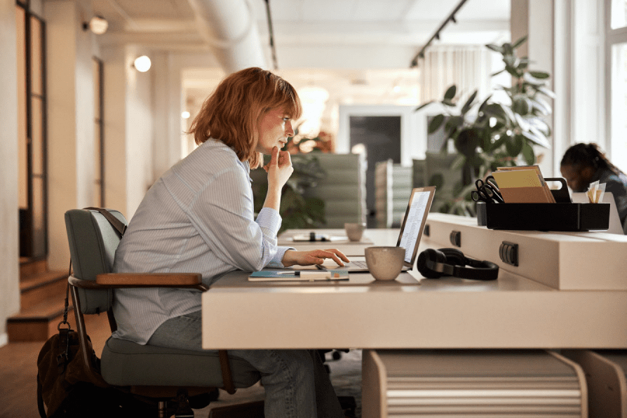 A woman working at her computer