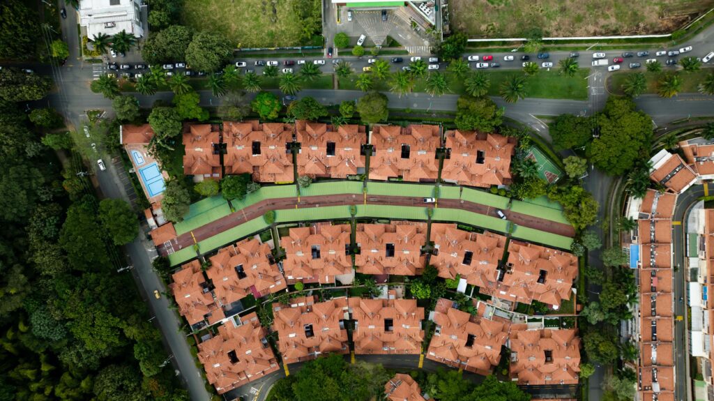 Aerial view of a new building complex—reflecting how enhanced Opportunity Zone benefits under the OBBB may drive new housing and infrastructure investments in underserved communities.