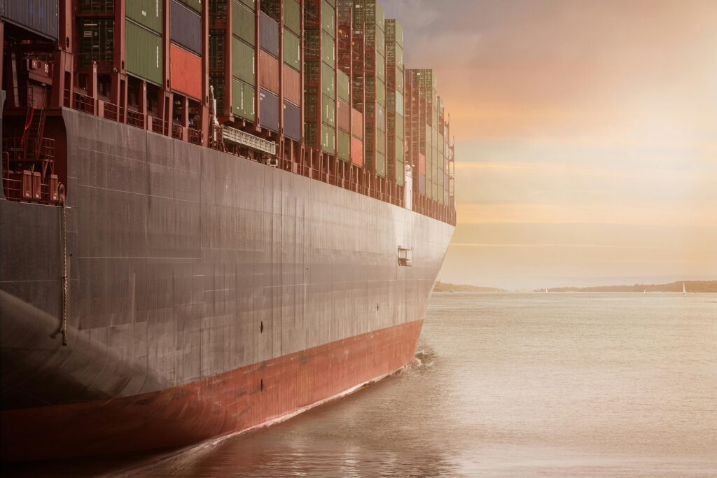 A cargo ship unloads containers stamped with customs codes and tariff declarations. The growing weight of trade taxes and fiscal shifts dominates the headlines this week—alongside Social Security warnings, filing season delays, and more.