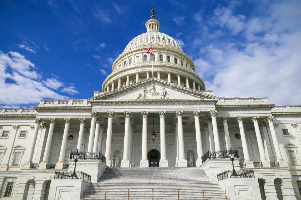 Exterior of federal Capital building, symbolizing tax policy, regulatory shifts, and shutdown impacts.