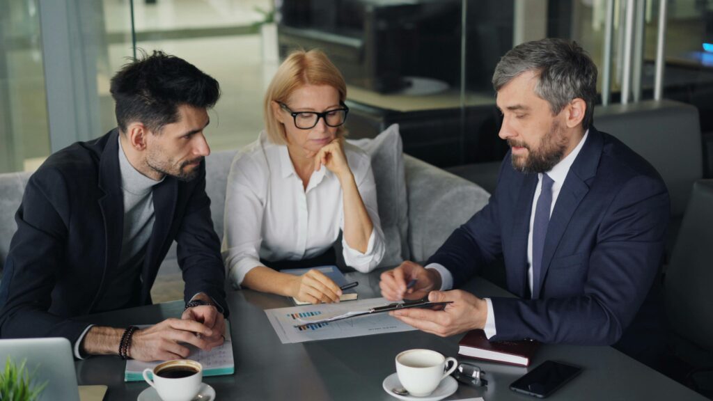 Tax advisors reviewing private equity fund documentation and providing strategic tax planning advice to clients.