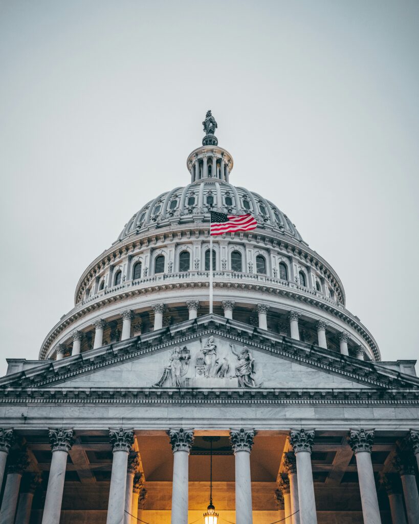 Exterior of the U.S. Capitol with cold skies and scaffolding, symbolizing congressional gridlock and the fragile path to ending the shutdown.