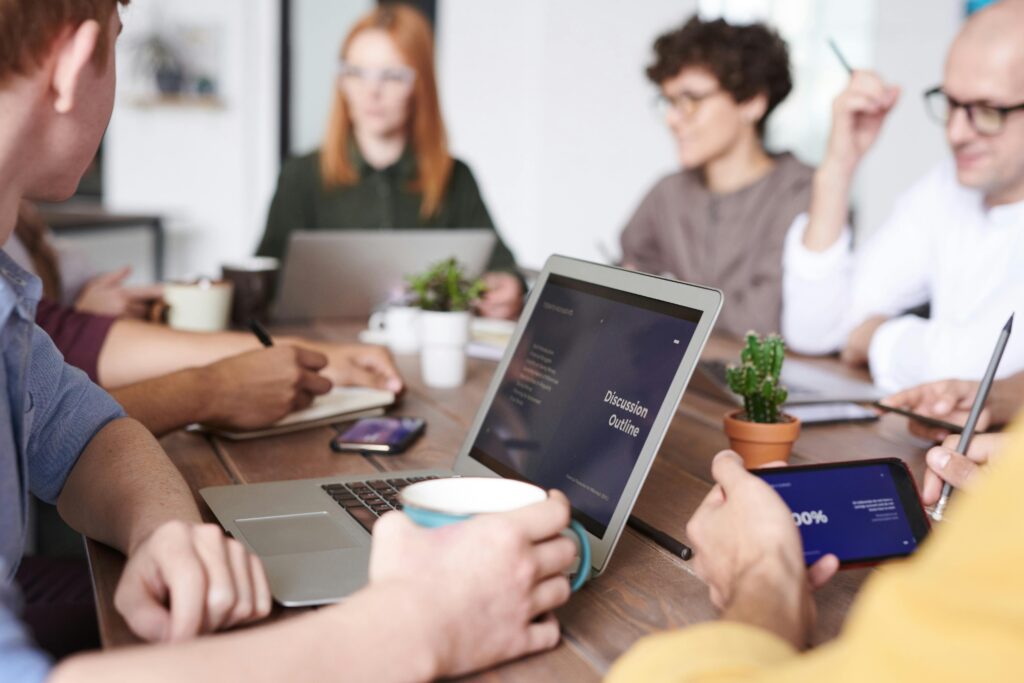 A group of people in a room discussing tax firm technology.