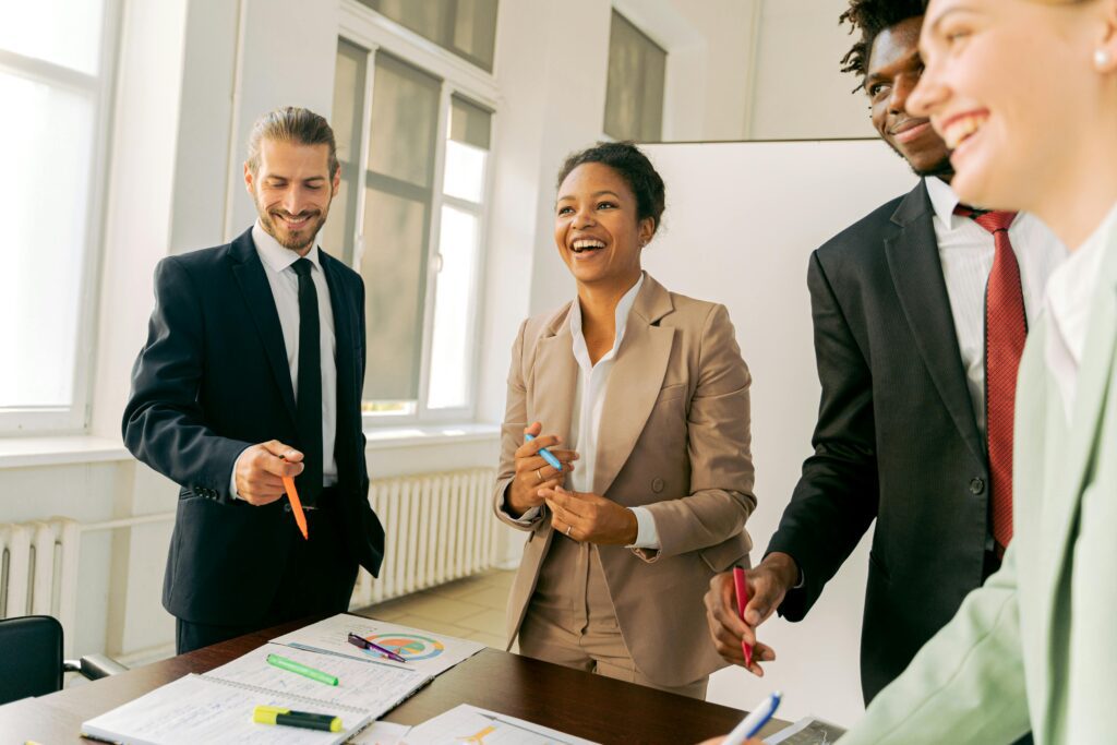 Colleagues collaborating in a productive work environment to enhance tax firm performance.